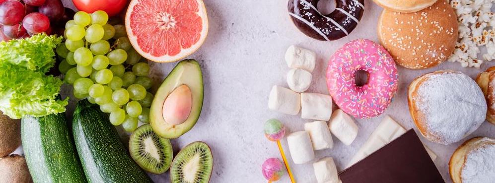 Photo of fruits and vegetables on the left, sweets on the right